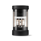 Black portable speaker with three glass cylinders, front