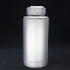 Titanium sport bottle, 1000 ml, standing on black, the HEXMONDE wordmark near the base