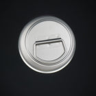 The bottle cap from above, its carry loop folded flat