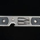Titanium bit driver from the front, two bits stored between the ends marked Tighten and Loosen