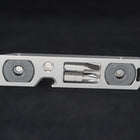 The bit driver at an angle, showing the hooked notch on its edge