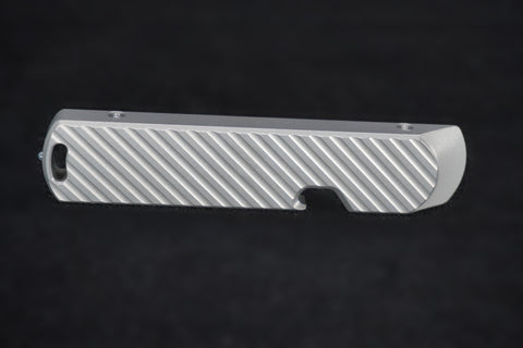 The back of the bit driver, cut with diagonal grooves