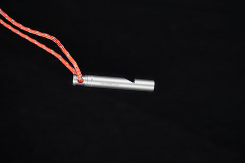 The whistle and lanyard seen from a lower angle
