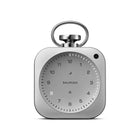Silver pocket-watch-shaped desk clock, front, with a glowing hour numeral and light ring