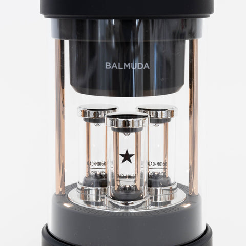 Close-up of the three glass cylinders and the LED-lit star