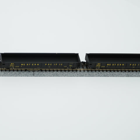 Two empty Western Pacific gondola cars coupled on N scale display track.