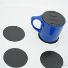 Slotted coaster on a mug, with three plain coasters