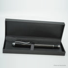 Pen in its black gift box with a carbon pattern