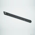 Carbon fiber ruler at an angle, showing the triangular hanging hole