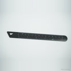 Black carbon fiber ruler with printed centimeter and inch scales, on light gray