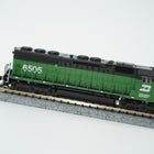 Side view of the Cascade Green Burlington Northern SD45 locomotive coupled to the flat car.