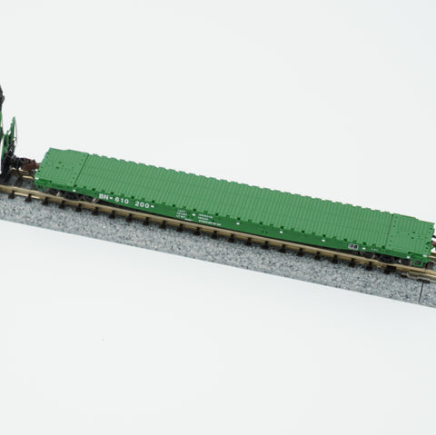 Close view of the green Burlington Northern flat car and its deck on display track.